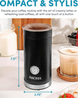 Black Aroma coffee maker on a kitchen counter with a glass of coffee and berries in the background.