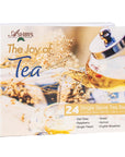 Box of Ashbys 'The Joy of Tea' with tea being poured into a glass on a white background