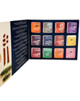 Tea bag set with colorful packaging in a display box, featuring a leaflet on the left on a white background.