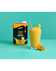 Glass cup with fruit smoothie with peach slices and straw next to Davinci Extreme Peach smoothie mix on an aqua and white background