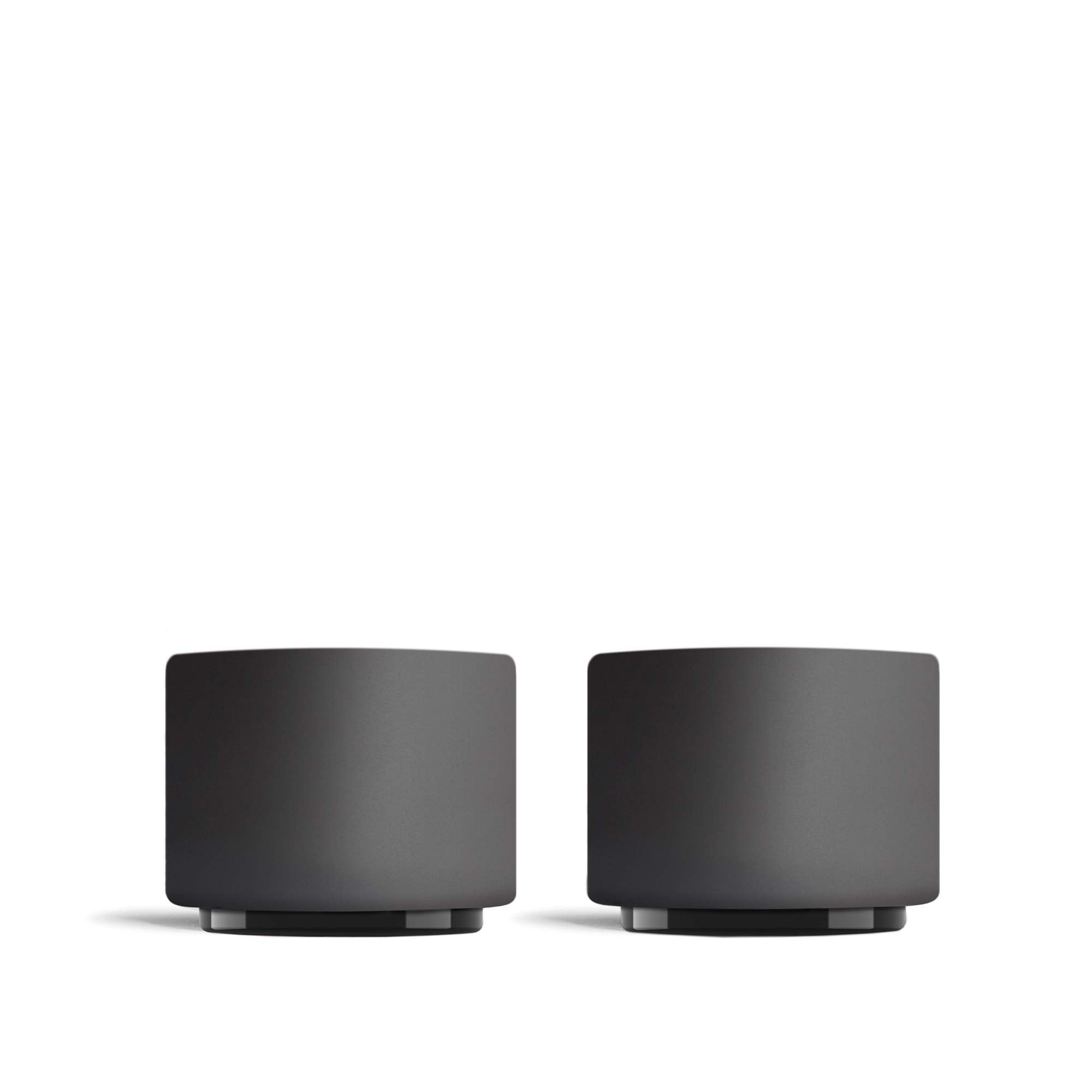 Two black monty milk art cups on a white background