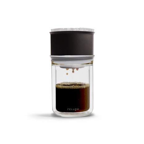 Glass coffee maker with black lid on a white background