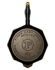 Bottom view of 10 inch FINEX Cast Iron Skillet with lid displayed on a white background
