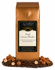 1 lb Decaf Cinnamon Hazelnut coffee beans bag with coffee beans, cinnamon sticks, and hazelnuts in front displayed on a white background