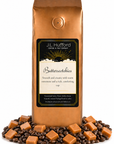 1 lb J.L. Hufford Butter Scotchies Coffee with coffee beans and butterscotch in front displayed on a white background