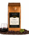 1 lb J.L. Hufford Cabernet coffee bag with coffee beans, red grapes, and a glass of cabernet on a white background