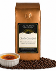 1 lb J.L. Hufford Chocolate Creme Brulee Coffee with coffee beans and creme brulee in front displayed on a white background