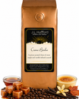 1 lb Creme Brulee coffee beans bag with coffee beans, blocks of caramel, maple syrup, vanilla sticks, and custard in front displayed on a white background