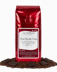 1 lb J.L. Hufford Dark Chocolate Ecstasy coffee bag with coffee beans and dark chocolate bars on a white background