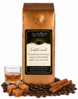 1 lb English Caramel coffee beans bag with coffee beans, cinnamon sticks, blocks of caramel, and a glass of rum in front displayed on a white background