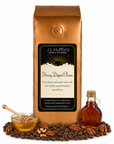 1 lb J.L. Hufford Honey Dipped Pecan coffee bag with coffee beans, pecans, honey, and jar of maple on a white background