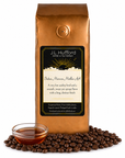 1 lb J.L. Hufford Indian Monsoon Mailbar AA coffee bag with coffee beans and clear bowl of syrup on a white background
