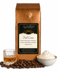1 lb J.L. Hufford Irish Cream coffee bag with coffee beans, glass of Irish whiskey, and bowl of whipped cream on a white background