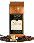 1 lb Kahlua Creme coffee beans bag with coffee beans and vanilla sticks in front displayed on a white background