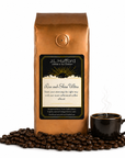 1 lb J.L. Hufford Rise and Shine Ultra coffee bag with coffee beans and mug of coffee on a white background