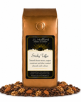 1 lb J.L. Hufford Sticky Toffee Coffee with coffee beans and roasted almonds and walnuts in front displayed on a white background