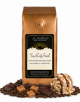1 lb J.L. Hufford Tin Roof Swirl Coffee with coffee beans, chocolate bars, caramel blocks, and ice cream with drizzled fudge and caramel in front displayed on a white background
