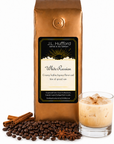 1 lb J.L. Hufford White Russian coffee bag with coffee beans, spices, and white Russian in a glass on a white background