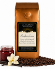 1 lb J.L. Hufford Raspberry Cream coffee bag with coffee beans, vanilla sticks, and a jar of raspberry jam on a white background