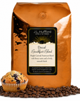 5 lb Decaf Breakfast Blend Coffee bag labeled 'J.L. Hufford' with a muffin and coffee beans on a white background