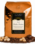 5 lb J.L. Hufford Decaf Chocolate Macadamia Coffee beans bag with coffee beans, chocolate bar, and macadamia in front displayed on a white background