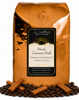 5 lb Decaf Cinnamon Stick coffee beans bag with coffee beans and cinnamon sticks in front displayed on a white background