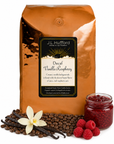 5 lb J.L. Hufford Decaf Vanilla Raspberry coffee bag with coffee beans, vanilla sticks, raspberries, and raspberry jam on a white background