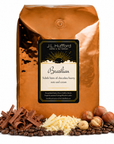 5 lb Brazilian Coffee bag with 'J.L. Hufford' branding and hazelnut, chocolate, vanilla chocolate, and coffee beans on a white background