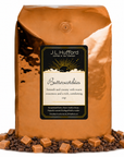 5 lb J.L. Hufford Butter Scotchies Coffee with coffee beans and butterscotch in front displayed on a white background