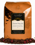 5 lb J.L. Hufford Chocolate Cherry Kiss coffee bag with coffee beans, chocolate bars, and cherries on a white background