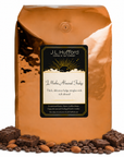 5 lb J.L. Hufford J Mocha Almond Fudge coffee bag with coffee beans, almonds, and fudge brownies on a white background
