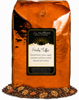 5 lb J.L. Hufford Sticky Toffee Coffee with coffee beans and roasted almonds and walnuts in front displayed on a white background