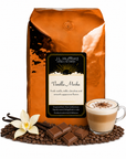 5 lb J.L. Hufford Vanilla Mocha coffee bag with coffee beans, vanilla sticks, milk chocolate, and a glass of a cappuccino on a white background