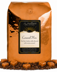 5 lb Coffee bag labeled 'Caramel Kiss' by J.L. Hufford with caramel candies and coffee beans on a white background