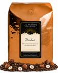 5 lb J.L. Hufford Hazelnut coffee bag with coffee beans and hazelnuts on a white background