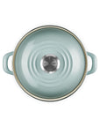 Top view of a sea salt 3.8 qt enamel on steel traditional petite stockpot with lid and handles on a white background
