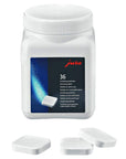 Jura white bottle for 36 descaling tablets with 3 white tablets in front of the bottle on a white background