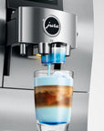 Jura syrup attachment for Jura automatic coffee machines pouring syrup into coffee