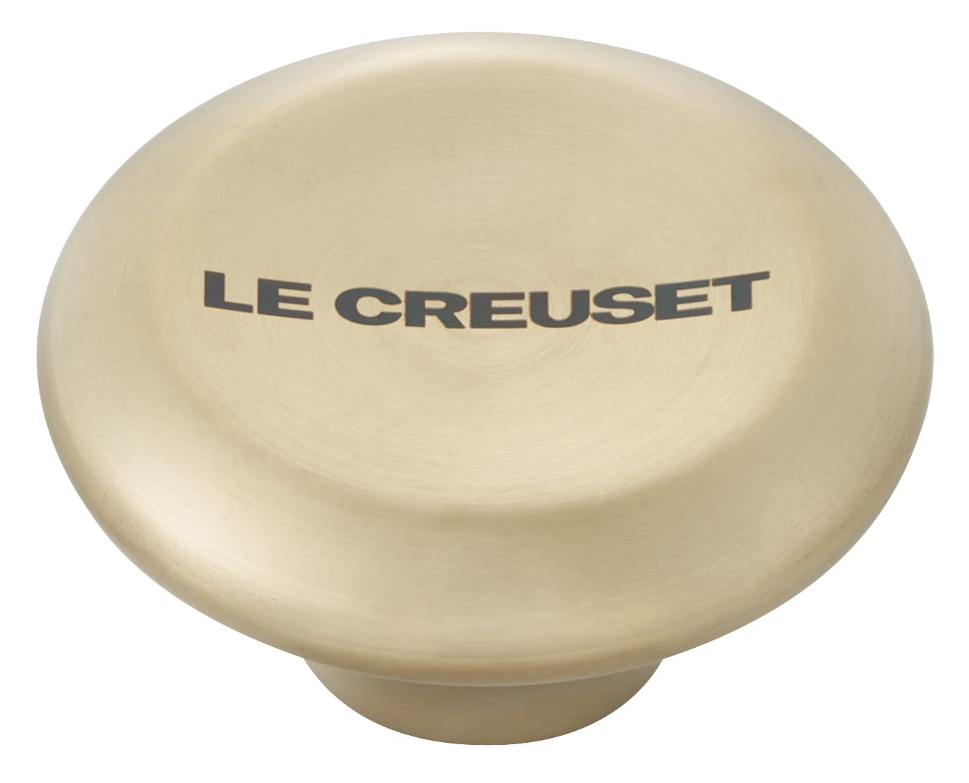 Light gold knob with 'Le Creuset' branding on a white background