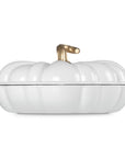White cast iron signature pumpkin braiser with a gold knob on a white background