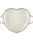 Top view of peche heart shaped 1.25 qt cocotte with handles displayed on a white background