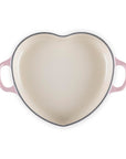Top view of chiffon pink heart shaped 1.25 qt cocotte with handles displayed on a white background