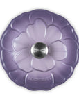 Purple cookware lid with floral design on a white background