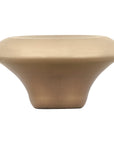 Light gold knob on a white background