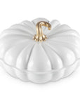 White cast iron signature pumpkin braiser with a gold knob on a white background