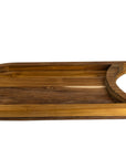 Bottom view of a teak chopping board with the raised platform with a cutout section for a plate on a white background