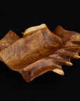 Rico & Plato vignerons teak wine bottle holder displayed on a black background