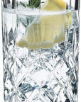 Riedel tumbler spey long drink with clear drink mix, lemon slice, and herb inside the glass on a white background