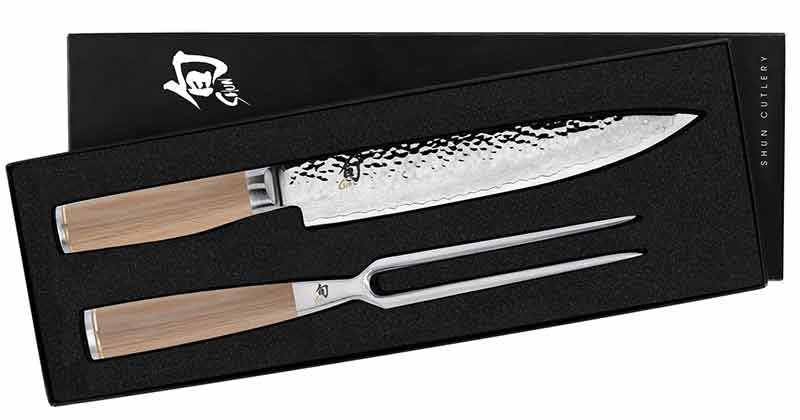 Carving knife and carving fork with wooden handles in a black box, featuring the Shun Culinary logo.