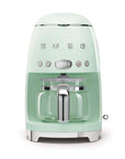 Front view of pastel green Smeg coffee machine on a white background